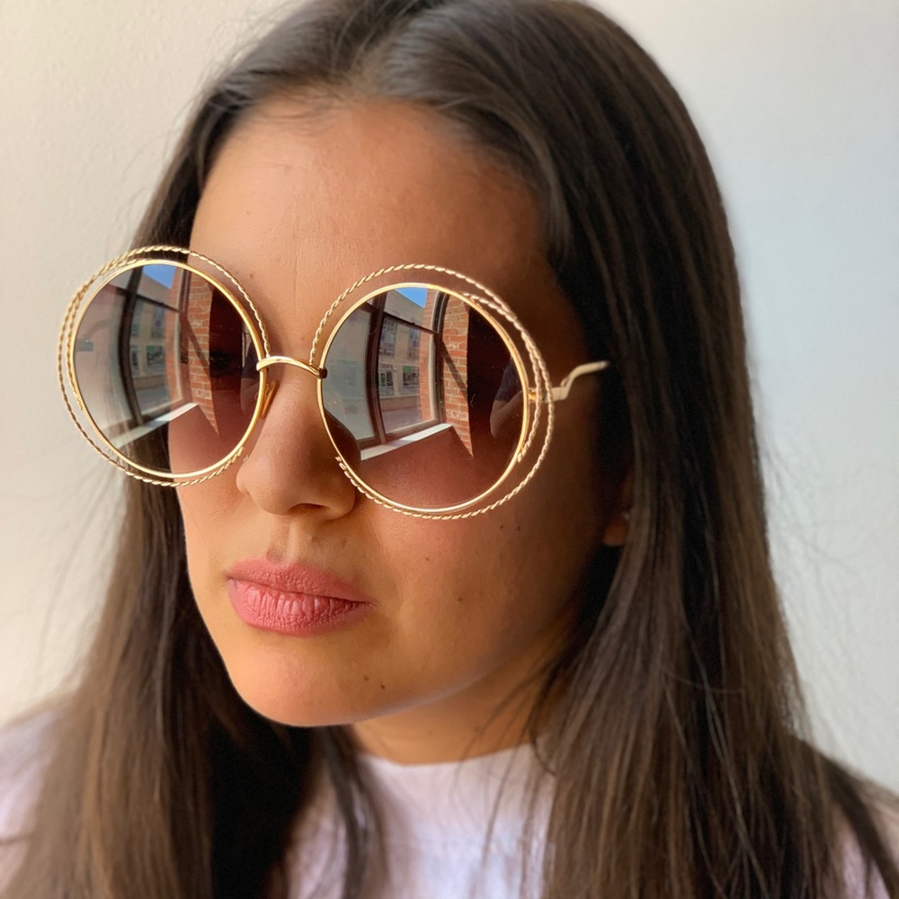 Black round frame sunglasses with gold hardware